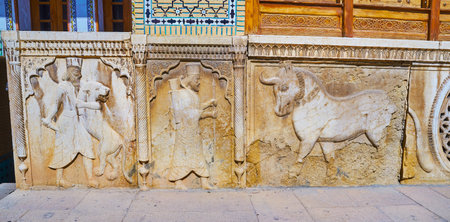 SHIRAZ, IRAN - OCTOBER 12, 2017: The stone panels on the facade of Qavam (Ghavam) House in Naranjestan complex are decorated with carvings, depicting ancient Persian themes, on October 12 in Shiraz.のeditorial素材