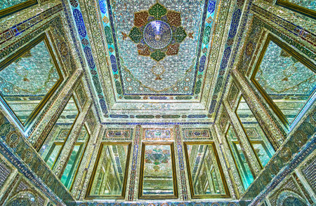 SHIRAZ, IRAN - OCTOBER 12, 2017: The rich decors of mirror hall of Qavam (Ghavam) House in Naranjestan complex, the patterns created of tine pieces of colored glass and mirror, on October 12 in Shiraz.のeditorial素材
