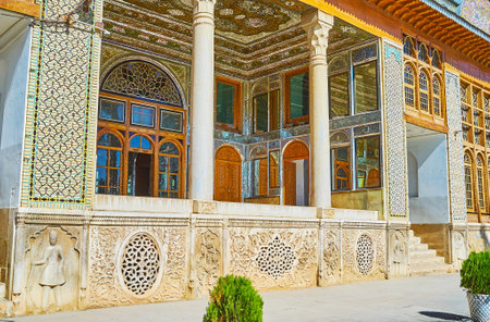 SHIRAZ, IRAN - OCTOBER 12, 2017: The splendid summer terrace in Qavam House of Naranjestan complex is decorated with fine mirror work, carved wood and painted details, on October 12 in Shiraz.のeditorial素材
