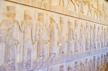 PERSEPOLIS, IRAN - OCTOBER 13, 2017: The relief on wall of Eastern Stairway of Apadana palace in Persepolis depicts the couriers of Persian ruler, on October 13 in Persepolis.のeditorial素材