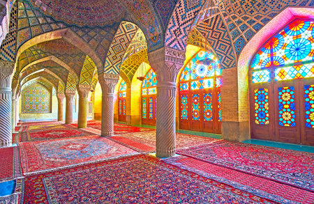 SHIRAZ, IRAN - OCTOBER 12, 2017: The Pink mosque with its amazing stained glass windows, decorating its interior with kaleidoscope of colored lights, on October 12 in Shiraz.のeditorial素材