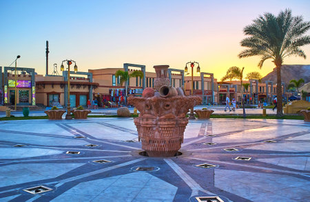 SHARM EL SHEIKH, EGYPT- DECEMBER 15, 2017: The scenic fountain in Sahaba mosque square of resort, the stores of Old Bazaar are seen on the background, on December 15 in Sharm El Sheikh.のeditorial素材