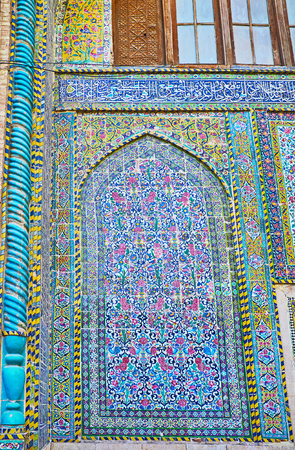 The portals (iwans) of Madraseh-ye Khan are mainly decorated with floral motives, fine complex patterns cover the small glazed tiles, Shiraz, Iranの写真素材