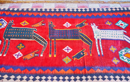Details of pattern of antique nomadic tribal carpet - colored animals, birds and geometric patterns, Vakil Bazaar, Shiraz, Iran.のeditorial素材