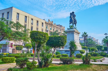 ALEXANDRIA, EGYPT - DECEMBER 17, 2017: The equestrian statue of Muhammad Ali Pasha among the trimmed bushes in garden of El-Tahrir square, on December 17 in Alexandria.のeditorial素材