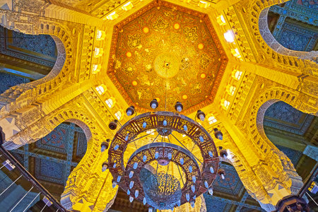 ALEXANDRIA, EGYPT - DECEMBER 17, 2017: The scenic cupola of Abu al-Abbas al-Mursi Mosque with stone arches from the sides and carved wooden decor in the middle, on December 17 in Alexandria.のeditorial素材