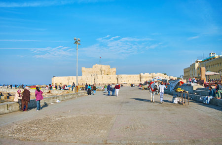 ALEXANDRIA, EGYPT - DECEMBER 17, 2017: The Qaitbay citadel is located on the tip of Pharos Island between Eastern and Western Harbors, this area is popular tourist location, on December 17 in Alexandria.のeditorial素材