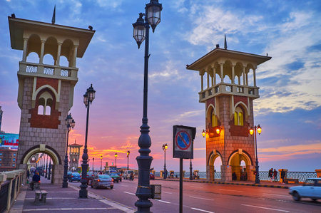 ALEXANDRIA, EGYPT - DECEMBER 17, 2017: The pleasant walk along the busy Stanley bridge, enjoying picturesque sunset sky, on December 17 in Alexandria.のeditorial素材