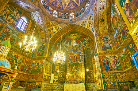ISFAHAN, IRAN - OCTOBER 20,2017: The altar of Holy Savior Cathedral (Surb Amenaprkich Vank) decorated with colored icons and rich golden patterns, on October 20 in Isfahan.のeditorial素材