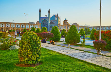 ISFAHAN, IRAN - OCTOBER 20, 2017: The splendid Naqsh-e Jahan square, famous for its medieval landmarks is decorated with large ornamental garden, on October 20 in Isfahan.のeditorial素材