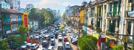 YANGON, MYANMAR - FEBRUARY 14, 2018: The obstructed traffic along the Anorata Road, one of the main avenues of Chinatown (Tayoke Tan), on February 14 in Yangon.のeditorial素材