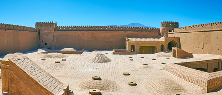 Restored courtyard of medieval Rayen Castle with domes of Governor's mansion, located on the lower level, Iran.の写真素材