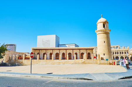 DOHA, QATAR - FEBRUARY 13, 2018: The facade of Souq Waqif mosque with small minaret, located in historical market area and surrounded by shopping quarters with stores, cafes and hotels, on February 13 in Doha.のeditorial素材
