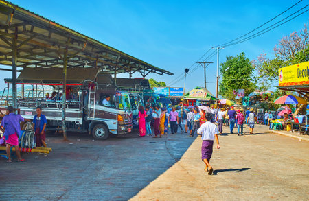 KYAIKTIYO, MYANMAR - FEBRUARY 16, 2018: The crowd at the truck station, pilgrims and tourists arrive...