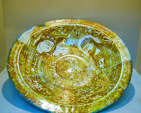 TEHRAN, IRAN - OCTOBER 24, 2017: Ancient restored plate with beautiful patterns and paintings displayed in Glass and Ceramic Museum, on October 24 in Tehran.のeditorial素材