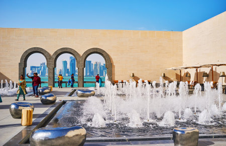 DOHA, QATAR - FEBRUARY 13, 2018: Islamic Art Museum boasts beautiful open air terrace with refreshing fountains, futuristic benches and cozy cafe, on February 13 in Doha.のeditorial素材