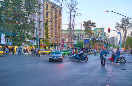 TEHRAN, IRAN - OCTOBER 25, 2017: Valiasr avenue is the most popular walking area in the city with planted trees ans pedestrian sidewalk on both sides of the road, on October 24 in Tehranのeditorial素材