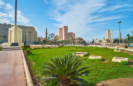 CAIRO, EGYPT - DECEMBER 24, 2017: The green lawn around the national flag amid Midan Al Tahrir - one of central city squares with numerous administrative buildings, Caito Museum, tourist hotels and stores, on December 24 in Cairoのeditorial素材