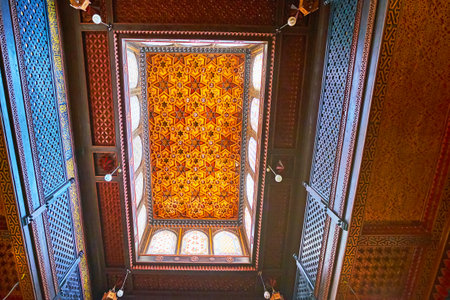 CAIRO, EGYPT - DECEMBER 24, 2017: Floral and stellar Islamic patterns on carved wooden ceiling of...