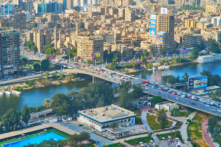 CAIRO, EGYPT - DECEMBER 24, 2017: Aerial view on dense buildings of Giza, 6th of October bridge and Nile river from the top of Cairo Tower on Gezira Island, on December 24 in Cairoのeditorial素材