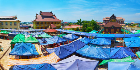 YWAMA, MYANMAR - FEBRUARY 18, 2018: The tents of large souvenir market in courtyard of Hpaung Daw U Pagoda, the famous Buddhist complex on Inle Lake, on February 18 in Ywama.のeditorial素材