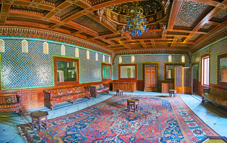 CAIRO, EGYPT - DECEMBER 24, 2017:  Panorama of the Moroccan Hall of Reception Palace of Manial complex with carved wooden ceiling and tiles on walls, on December 24 in Cairoのeditorial素材