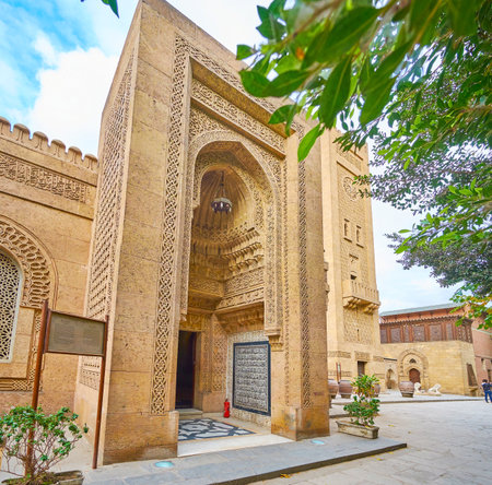 CAIRO, EGYPT - DECEMBER 24, 2017: The main iwan (portal) of Manial Palace mosque with complex stone carvings, muqarnas ornaments and scenic calligraphic panel, on December 24 in Cairoのeditorial素材