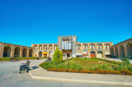 KERMAN, IRAN - OCTOBER 15, 2017: The flower beds decorate Ganjali Khan square - historical destination, located between the Grand Bazaar, medieval caravanserai and Hammam, on October 15 in Kerman.のeditorial素材