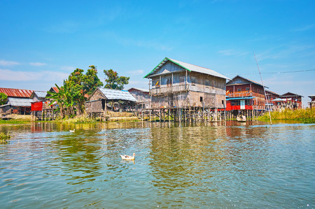 The old stilt houses of wood and woven bamboo on Inle Lake, Inpawkhon village, Myanmar.の写真素材