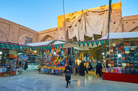KERMAN, IRAN - OCTOBER 15, 2017: The square of Sardar Bazaar with brick portals and numerous stalls, on October 15 in Kerman.のeditorial素材