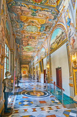 VALLETTA, MALTA - JUNE 17, 2018: The richly decorated corridor of Grandmaster's Palace with colorful murals on ceiling and walls, stone mosaic floor and, knights in armour, on June 17 in Valletta.のeditorial素材