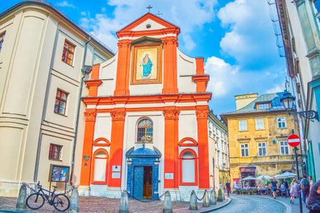 KRAKOW, POLAND - JUNE 11, 2018: Small Church of St John the Baptist and John the Evangelist hidden on narrow lane in old town, on June 11 in Krakow.2のeditorial素材