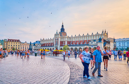 KRAKOW, POLAND - JUNE 11, 2018: The view on Main Market Sqaure with Cloth Hall in the evening lights, on June 11 in Krakowのeditorial素材