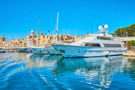 The ferry terminal in Birgu (Vittoriosa) is neighboring with the shipyards, full of modern yachts, Malta.のeditorial素材