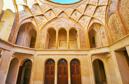 KASHAN, IRAN - OCTOBER 22, 2017: Interior of a room in Tabatabaei House, walls and dome are decorated with muqarnas reliefs and preserved frescoes, on October 22 in Kashan.のeditorial素材