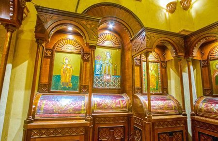CAIRO, EGYPT - DECEMBER 23, 2017: The medieval icons in byzantine and greek styles in wooden kiots...