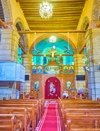 CAIRO, EGYPT - DECEMBER 23, 2017: The carved wooden sanctuary screen in St George Church with ivory inlays and row of icons on the top is the most common in Coptic churches, on December 23 in Cairo.のeditorial素材
