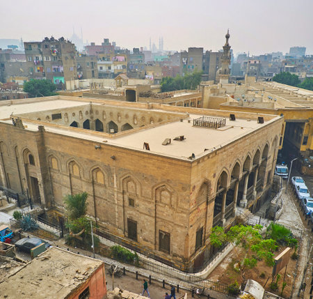 The tall Bab Zuwayla Gate is fne place to observe medieval Al Salih Tala'i mosque with beautiful porch and large courtyard, Cairo, Egypt.のeditorial素材
