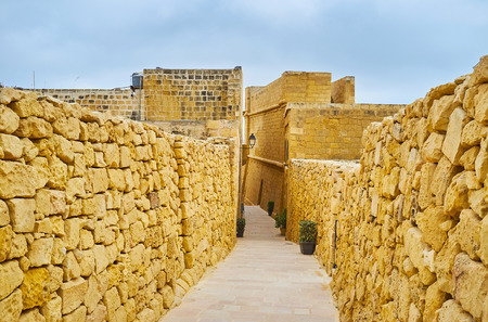 Rabat Citadel is perfect place to walk the narrow stone streets, explore preserved architectural pieces and feel the spirit of Middle Ages, Victoria, Gozo Island, Malta.の写真素材