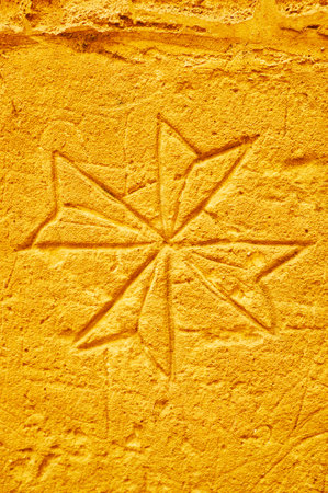 VICTORIA, MALTA - JUNE 15, 2018: The etched Maltese Cross depicted by medieval prisonner on the wall of the cell in Old Prison of Rabat Citadel, on June 15 in Victoria.のeditorial素材