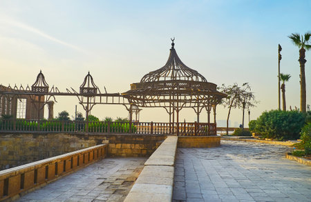 The sunset sky behind the scenic wooden porch of Al-Gawhara (Bijou) Palace of Sladin Citadel, Cairo, Egypt.のeditorial素材