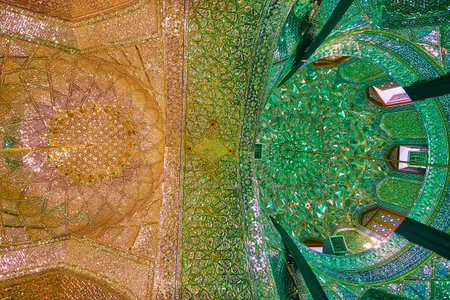 SHIRAZ, IRAN - OCTOBER 12, 2017: Mirror Hall of Imamzadeh Ali Ibn Hamzeh Shrine - two domes, divided with ornate arch and decorated with muqarnas and patterns of glass pieces, on October 12 in Shirazのeditorial素材