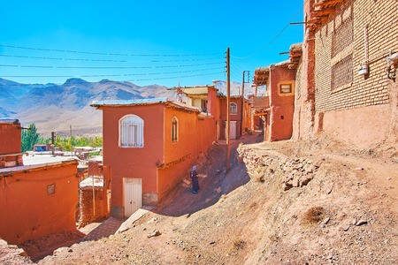 The steep descent between the terrace streets of ancient adobe village, Abyaneh, Iran.の写真素材