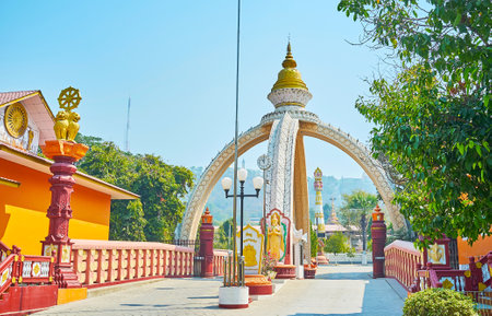 SAGAING, MYANMAR - FEBRUARY 21, 2018: The entrance to Sitagu International Buddhist Academy with richly decorated construction in shape of stupa, sculptures and columns, on February 21 in Sagaingのeditorial素材