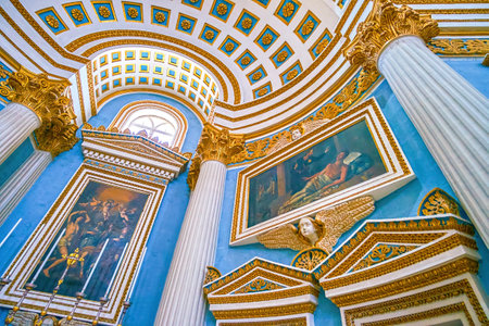 MOSTA, MALTA - JUNE 14, 2018: The interior of Basilica of Assumption of Our Lady decorated with paintings , depicting scenes from the Holy Bible, on June 14 in Mosta.のeditorial素材