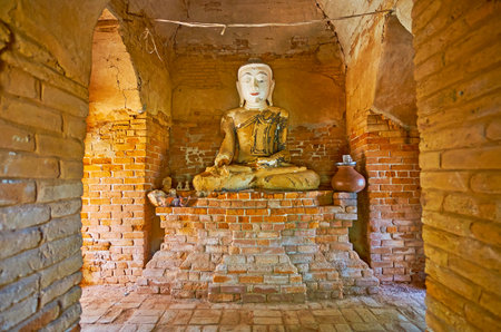 AVA, MYANMAR - FEBRUARY 21, 2018: Interior of shrine in Daw Gyan Pagoda complex with image of Lord Buddha Touching Earth, on February 21 in Ava.のeditorial素材