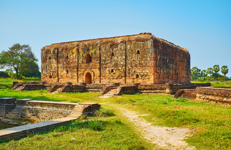 The ruins of Wingaba Monastery - one of the most unusual for Burmese architecture historical landmarks of archaeological site in Ava (Inwa), Myanmar.の写真素材