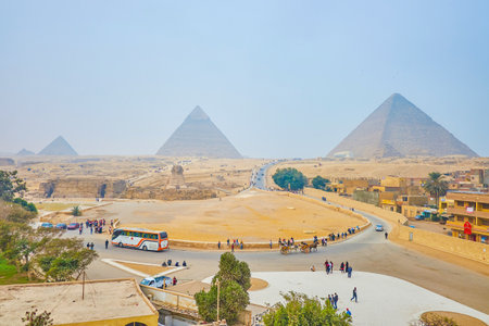 GIZA, EGYPT - DECEMBER 20, 2017: Panorama of Giza Necropolis with its iconic landmarks - Great Pyramids and Sphinx, built in desert, on December 20 in Giza.のeditorial素材