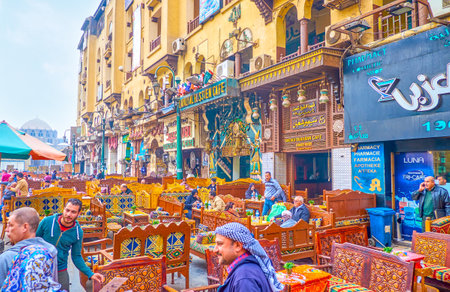 CAIRO, EGYPT - DECEMBER 20, 2017: The lines of traditional restaurants with colorful carved wooden...