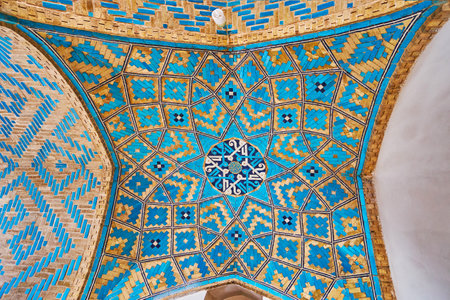 YAZD, IRAN - OCTOBER 18, 2017: The small dome in corridor of Jameh Mosque decorated with fusion of...